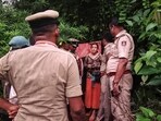 Security personnel rescue a Russian woman and her two children from a remote cave in Ramatirtha hills, in Uttara Kannada district, Karnataka.