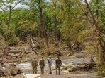 Crews scout out locations to send a cadaver dog team during continued search and recovery operations on the bank of the Guadalupe River Crews scout out locations to send a cadaver dog team during continued search and recovery operations on the bank of the Guadalupe River