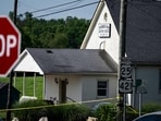 Police assess the scene after a shooting at Richmond Road Baptist Church on July 13, 2025 in Lexington