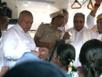 Siddaramaiah, DKS and Ramalinga Reddy distribute free tickets to women inside the bus while implementing Shakti scheme. 
