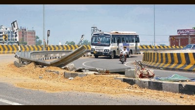 A part of the road got damaged after a truck loaded with sand and gravel overturned, causing traffic disruption along the Ferozepur Road. (Manish/HT) A part of the road got damaged after a truck loaded with sand and gravel overturned, causing traffic disruption along the Ferozepur Road. (Manish/HT)