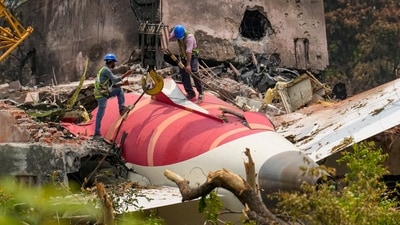 Wreckage of the crashed Air India plane being lifted by a crane, in Ahmedabad, Gujarat, on June 14. (PTI)