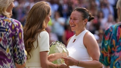 Amanda Anisimova of the U.S. receives her runners-up trophy from Kate, Princess of Wales, after losing to Poland's Iga Swiatek during the women's single final at the Wimbledon Tennis Championships in London, Saturday, July 12, 2025. (AP Photo/Kin Cheung) (AP) Amanda Anisimova of the U.S. receives her runners-up trophy from Kate, Princess of Wales, after losing to Poland's Iga Swiatek during the women's single final at the Wimbledon Tennis Championships in London, Saturday, July 12, 2025. (AP Photo/Kin Cheung) (AP)