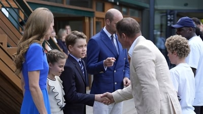 Britain's Prince William, center, Kate, Princess of Wales, left, Prince George, 3rd left, and Princess Charlotte, 2nd left, meet Steve Backshall. (AP)