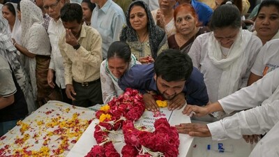 Relatives mourning by the coffins of victims, who were killed in the Air India flight AI171 crash. (File Photo/AFP) Relatives mourning by the coffins of victims, who were killed in the Air India flight AI171 crash. (File Photo/AFP)