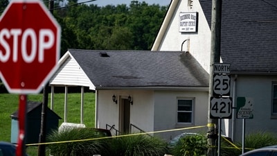 Police assess the scene after a shooting at Richmond Road Baptist Church on July 13, 2025 in Lexington (Getty Images via AFP) Police assess the scene after a shooting at Richmond Road Baptist Church on July 13, 2025 in Lexington (Getty Images via AFP)