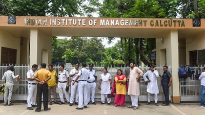 Police personnel deployed outside IIM Calcutta after a student was allegedly raped inside the boys' hostel of the institute, in Kolkata. (PTI) Police personnel deployed outside IIM Calcutta after a student was allegedly raped inside the boys' hostel of the institute, in Kolkata. (PTI)