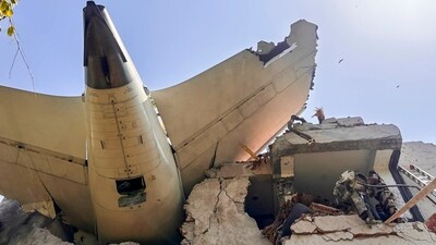 Remains of an Air India plane, that crashed moments after taking off from Sardar Vallabhbhai Patel International Airport, lies on a building in Ahmedabad. (AFP PHOTO/CISF)