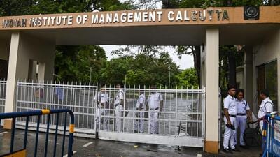 Police personnel deployed at IIM Calcutta after a student was allegedly raped inside the boys' hostel of the institute, in Kolkata, on Sunday. (PTI) Police personnel deployed at IIM Calcutta after a student was allegedly raped inside the boys' hostel of the institute, in Kolkata, on Sunday. (PTI)