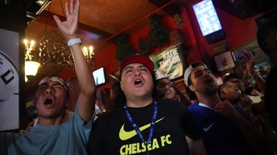 At The Football Factory, Chelsea fans scream and cheer passionately as they prepare for the Club World Cup Final versus Paris Saint-Germain. REUTERS/Hannah Mckay (REUTERS)