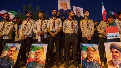 TOPSHOT - Members of the scouting movement stand behind pictures of Lebanese Hezbollah's slain leader Hassan Nasrallah (R) and Iran's Islamic Revolutionary Guard Corps (IRGC) commander Hossein Salami (2nd-R) and others during a memorial vigil mourning slain members of the IRGC and scientists killed in recent Israeli airstrikes, outside the Iranian embassy headquarters in Baghdad on June 28 (AFP) TOPSHOT - Members of the scouting movement stand behind pictures of Lebanese Hezbollah's slain leader Hassan Nasrallah (R) and Iran's Islamic Revolutionary Guard Corps (IRGC) commander Hossein Salami (2nd-R) and others during a memorial vigil mourning slain members of the IRGC and scientists killed in recent Israeli airstrikes, outside the Iranian embassy headquarters in Baghdad on June 28 (AFP)