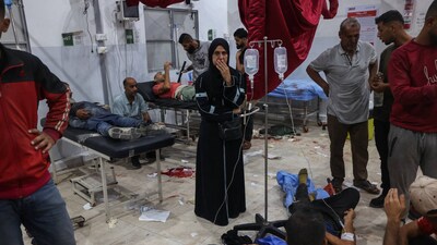 People injured at an aid-distribution point receiving medical treatment in the Gaza Strip. People injured at an aid-distribution point receiving medical treatment in the Gaza Strip.