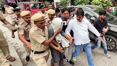 The Father of the deceased Radhika Yadav, Deepak Yadav, being taken to police remand after the court's order, in Gurugram on Friday. (ANI ) The Father of the deceased Radhika Yadav, Deepak Yadav, being taken to police remand after the court's order, in Gurugram on Friday. (ANI )