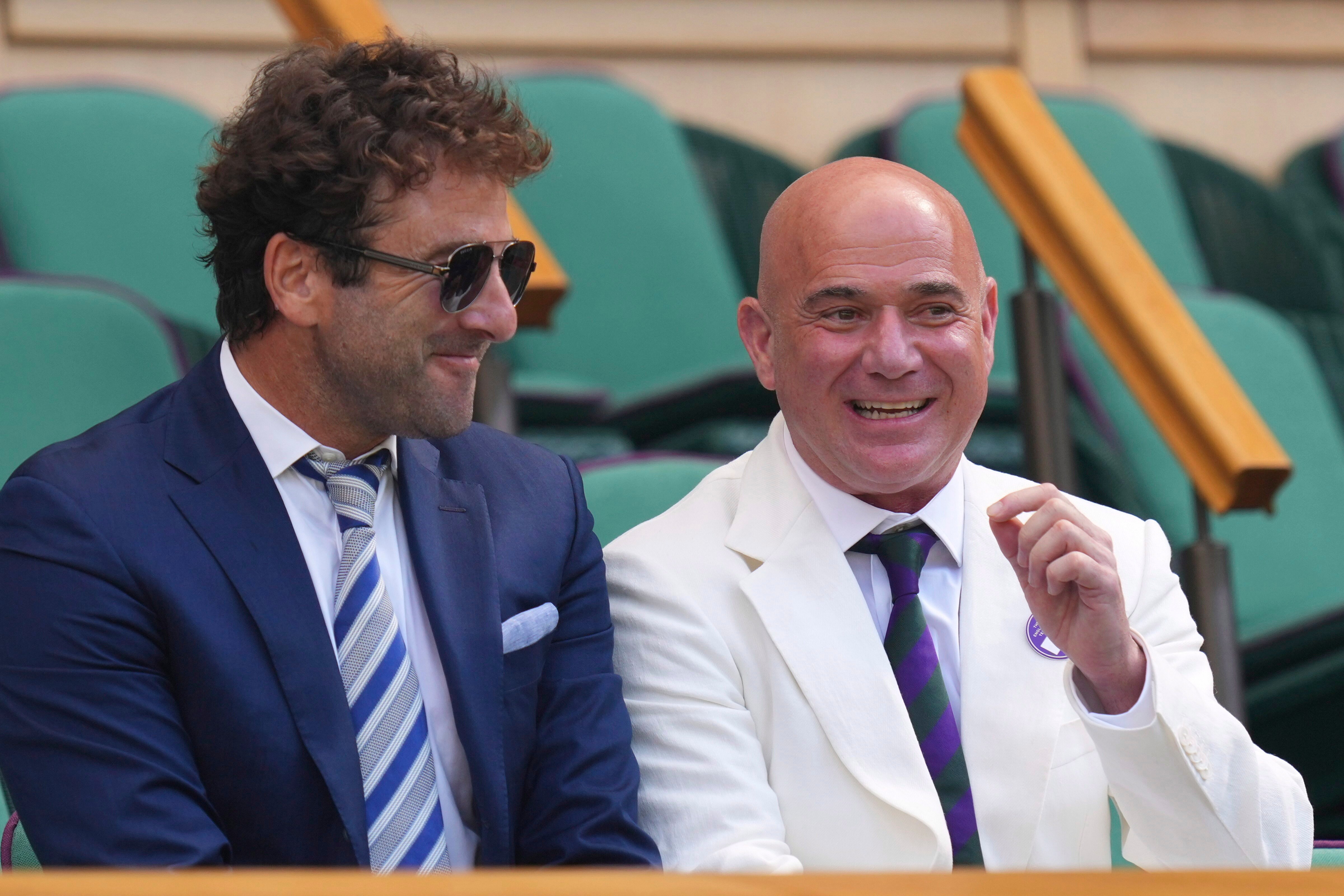 Former tennis player Andre Agassi and Justin Gimelstob attend the Royal Box to watch Jannik Sinner of Italy and Carlos Alcaraz of Spain during their men's singles final match at the Wimbledon Tennis Championships in London, Sunday, July 13, 2025. (AP/PTI Photo)(AP07_13_2025_000424A) (AP) Former tennis player Andre Agassi and Justin Gimelstob attend the Royal Box to watch Jannik Sinner of Italy and Carlos Alcaraz of Spain during their men's singles final match at the Wimbledon Tennis Championships in London, Sunday, July 13, 2025. (AP/PTI Photo)(AP07_13_2025_000424A) (AP)