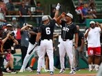 East team infielder Jerry Hairston (6) celebrates with his teammate during the Home Run Derby 
