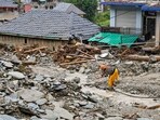 Mandi: A woman at a damaged residential area in the aftermath of a cloudburst, at Thunag in Mandi district, Himachal Pradesh, Mandi: A woman at a damaged residential area in the aftermath of a cloudburst, at Thunag in Mandi district, Himachal Pradesh,