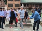 Jammu and Kashmir Chief Minister Omar Abdullah pays tribute to July 13 martyrs at Naqshband Sahib graveyard in Old City of Srinagar, Monday, July 14, 2025. A day after being locked indoors, J-K CM and other JKNC leaders on Monday slipped through security barricades to pay tributes at the graveyard. Jammu and Kashmir Chief Minister Omar Abdullah pays tribute to July 13 martyrs at Naqshband Sahib graveyard in Old City of Srinagar, Monday, July 14, 2025. A day after being locked indoors, J-K CM and other JKNC leaders on Monday slipped through security barricades to pay tributes at the graveyard.