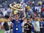 Chelsea's Cole Palmer celebrates with the trophy after winning the FIFA Club World Cup