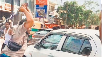 A video of the incident shows a mob vandalising a car on a busy street. (HT photo)