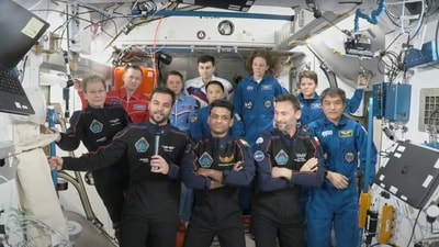 TAxiom Space crew of four, in dark suits, from left, Axiom mission commander Peggy Whitson, Hungary's Tibor Kapu, India's Shubhanshu Shukla and Poland's Slawosz Uznanski-Wisniewski, during a farewell ceremony aboard the International Space Station on Sunday, July 13, 2025. (AP) TAxiom Space crew of four, in dark suits, from left, Axiom mission commander Peggy Whitson, Hungary's Tibor Kapu, India's Shubhanshu Shukla and Poland's Slawosz Uznanski-Wisniewski, during a farewell ceremony aboard the International Space Station on Sunday, July 13, 2025. (AP)