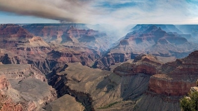 Smoke billows over the Grand Canyon, Arizona, U.S., in this image released on July 12, 2025, obtained from social media. NPS Photo/M. Quinn via REUTERS  THIS IMAGE HAS BEEN SUPPLIED BY A THIRD PARTY. MANDATORY CREDIT. NO RESALES. NO ARCHIVES. (via REUTERS)