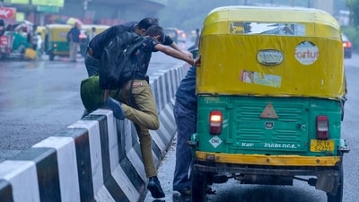 Commuters rush to catch autos near ISBT Kashmere Gate Road in New Delhi after witnessing heavy rain on Monday, July 14, 2025. (RAJ K RAJ /HT PHOTO) Commuters rush to catch autos near ISBT Kashmere Gate Road in New Delhi after witnessing heavy rain on Monday, July 14, 2025. (RAJ K RAJ /HT PHOTO)