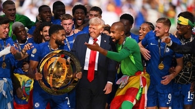 Trump smiles, interacts with Chelsea players after their team's victory as U.S. President Donald Trump reacts following the FIFA Club World Cup 2025 Final match between Chelsea FC and Paris Saint-Germain at MetLife Stadium on July 13, 2025 in East Rutherford, New Jersey. David Ramos/Getty Images/AFP (Photo by David Ramos / GETTY IMAGES NORTH AMERICA / Getty Images via AFP) (Getty Images via AFP) Trump smiles, interacts with Chelsea players after their team's victory as U.S. President Donald Trump reacts following the FIFA Club World Cup 2025 Final match between Chelsea FC and Paris Saint-Germain at MetLife Stadium on July 13, 2025 in East Rutherford, New Jersey. David Ramos/Getty Images/AFP (Photo by David Ramos / GETTY IMAGES NORTH AMERICA / Getty Images via AFP) (Getty Images via AFP)