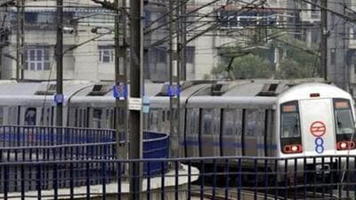 New Delhi, India - 19 August 2013 - The Eight coach metro leaving Ashok Nagar station on its maiden run in New Delhi India on Monday 19 August 2013, The Delhi Metro Rail Corporation is pressing the first eight-coach train into service on the crowded Blue line, as the Dwarka Sector 21 to Noida City Centre/Vaishali route. Photo by Mohd Zakir / Hindustan Times New Delhi, India - 19 August 2013 - The Eight coach metro leaving Ashok Nagar station on its maiden run in New Delhi India on Monday 19 August 2013, The Delhi Metro Rail Corporation is pressing the first eight-coach train into service on the crowded Blue line, as the Dwarka Sector 21 to Noida City Centre/Vaishali route. Photo by Mohd Zakir / Hindustan Times