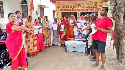 Voters show the enumeration forms given by a Booth Level Officer during the ongoing special intensive revision of electoral rolls in Bihar. (@ECISVEEP) Voters show the enumeration forms given by a Booth Level Officer during the ongoing special intensive revision of electoral rolls in Bihar. (@ECISVEEP)