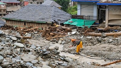 Mandi: A woman at a damaged residential area in the aftermath of a cloudburst, at Thunag in Mandi district, Himachal Pradesh, (PTI) Mandi: A woman at a damaged residential area in the aftermath of a cloudburst, at Thunag in Mandi district, Himachal Pradesh, (PTI)
