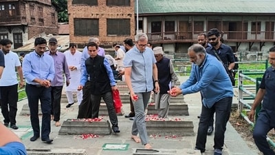 Jammu and Kashmir Chief Minister Omar Abdullah pays tribute to July 13 martyrs at Naqshband Sahib graveyard in Old City of Srinagar, Monday, July 14, 2025. A day after being locked indoors, J-K CM and other JKNC leaders on Monday slipped through security barricades to pay tributes at the graveyard. (PTI) Jammu and Kashmir Chief Minister Omar Abdullah pays tribute to July 13 martyrs at Naqshband Sahib graveyard in Old City of Srinagar, Monday, July 14, 2025. A day after being locked indoors, J-K CM and other JKNC leaders on Monday slipped through security barricades to pay tributes at the graveyard. (PTI)