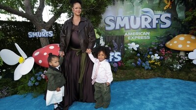Rihanna showed off her baby bump on the blue carpet while dressed in a ball gown and an edgy jacket.&nbsp; (REUTERS)