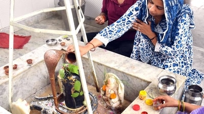 Sawan Somwar 2025: Devotees perform 'Abhishek' of Shivling on the first day of the Sawan month. (Ashish Maitra ANI) Sawan Somwar 2025: Devotees perform 'Abhishek' of Shivling on the first day of the Sawan month. (Ashish Maitra ANI)