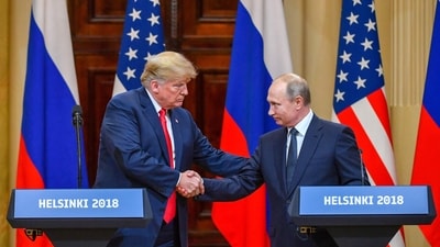 US President Donald Trump and Russia's President Vladimir Putin shake hands before attending a joint press conference.. (AFP File) US President Donald Trump and Russia's President Vladimir Putin shake hands before attending a joint press conference.. (AFP File)