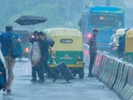Commuters are seen during a Evening rain at ISBT Kashmere Gate Road in New Delhi, India, Commuters are seen during a Evening rain at ISBT Kashmere Gate Road in New Delhi, India,