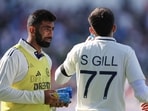 India's Jasprit Bumrah, left, carries refreshments for captain Shubman Gill during a break. India's Jasprit Bumrah, left, carries refreshments for captain Shubman Gill during a break.