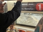 Video posted on social media appears to show water flooding down into a Manhattan subway station.