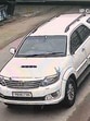 The CCTV grab of the Toyota Fortuner that hit centenarian marathon runner Fauja Singh on Monday. (HT )