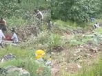 A Tempo Traveller veered off the road and plunged into a deep gorge A Tempo Traveller veered off the road and plunged into a deep gorge