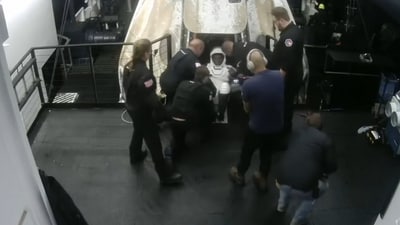 Operation personnel start bringing the crew out of their home for the last twenty days, the Axiom Dragon spacecraft. (Video grab/Axiom Space) Operation personnel start bringing the crew out of their home for the last twenty days, the Axiom Dragon spacecraft. (Video grab/Axiom Space)