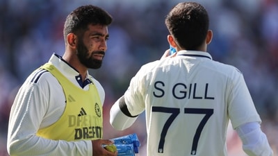India's Jasprit Bumrah, left, carries refreshments for captain Shubman Gill during a break. (AP) India's Jasprit Bumrah, left, carries refreshments for captain Shubman Gill during a break. (AP)