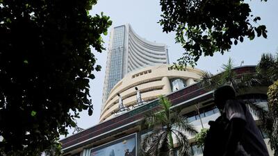 FILE PHOTO: Men walk past a screen displaying market results outside the Bombay Stock Exchange (BSE) in Mumbai, India (REUTERS) FILE PHOTO: Men walk past a screen displaying market results outside the Bombay Stock Exchange (BSE) in Mumbai, India (REUTERS)