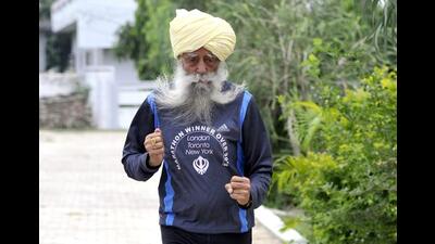Fauja Singh, who was 114 years old, died after being hit by an unidentified vehicle while crossing a road at his native Beas village in Jalandhar district on Monday afternoon. (HT file photo) Fauja Singh, who was 114 years old, died after being hit by an unidentified vehicle while crossing a road at his native Beas village in Jalandhar district on Monday afternoon. (HT file photo)