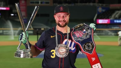 Seattle Mariners catcher Cal Raleigh (29) holds the trophy after winning the 2025 Home Run Derby (IMAGN IMAGES via Reuters Connect)