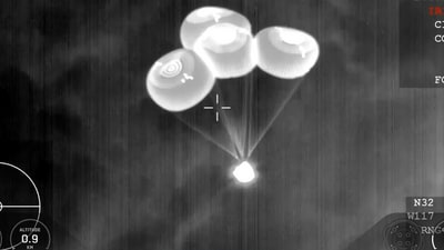Parachutes flap open as the Dragon spacecraft makes its way to Earth. (Video grab/Axiom Space) Parachutes flap open as the Dragon spacecraft makes its way to Earth. (Video grab/Axiom Space)