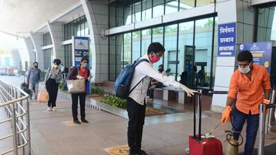 Pune, India - May 29, 2020:Passengers get their luggage sanitized and get thermal check up and show the registered Arogya sethu app ahead of boarding the flight at Pune International Airport in Pune, India, on Friday, May 29, 2020. (Photo by Shankar Narayan/HT PHOTO)