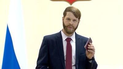 Daniel Martindale said was he "voluntarily and consciously accepting the citizenship of the Russian Federation, swear to observe the Constitution" (Reuters)