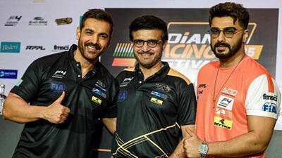 Racing team owners Sourav Ganguly, actors John Abraham (left) and Arjun Kapoor (right). (AFP)
