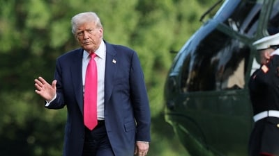 U.S. President Donald Trump waves and walks across the South Lawn as he arrives home from a day trip in Pennsylvania to the White House in Washington, D.C., U.S., July 15, 2025. (REUTERS)
