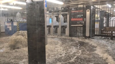 A view shows a flooded subway station in New York, ( via REUTERS)